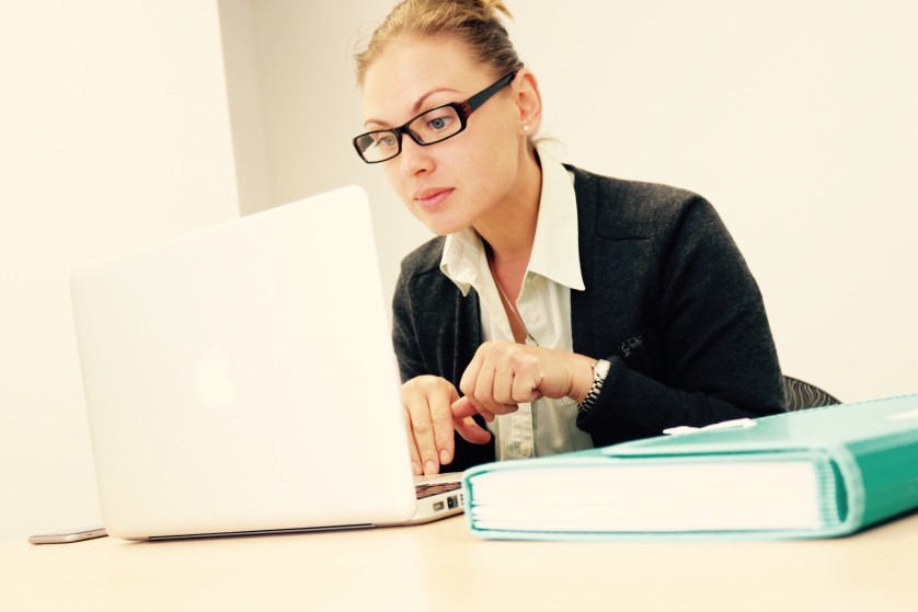 expert grant writer reviewing client information for custom grant-writing