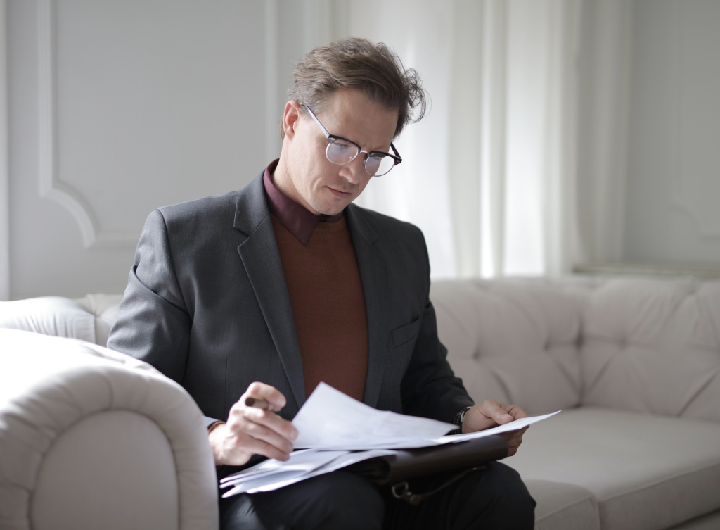 man reviewing grant proposals