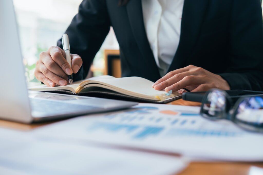 businessman writing grant proposal