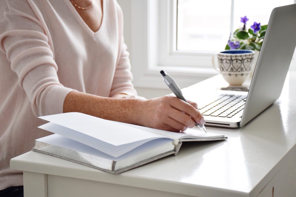 businesswoman writing grant proposal