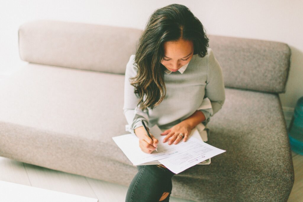 young woman reviewing office paperwork